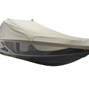 A boat covered with a white protective tarp.