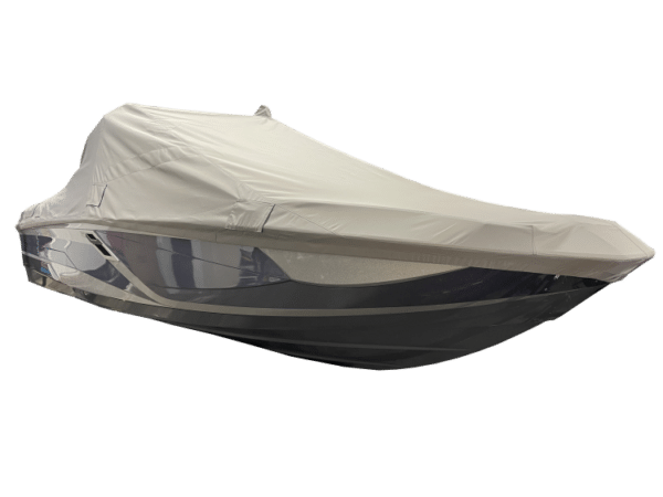 A boat covered with a white protective tarp.