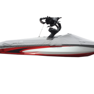 A covered red and white speedboat with an attached sculpture of a person water skiing.