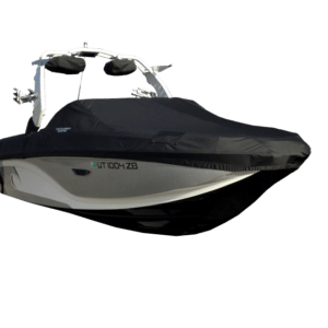 A covered speedboat with a black tarp is fully enclosed, showcasing a sleek design with a white hull and visible registration numbers on the side.