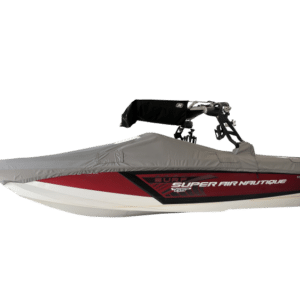 Red and white Super Air Nautique boat with a gray cover and a wakeboard tower.